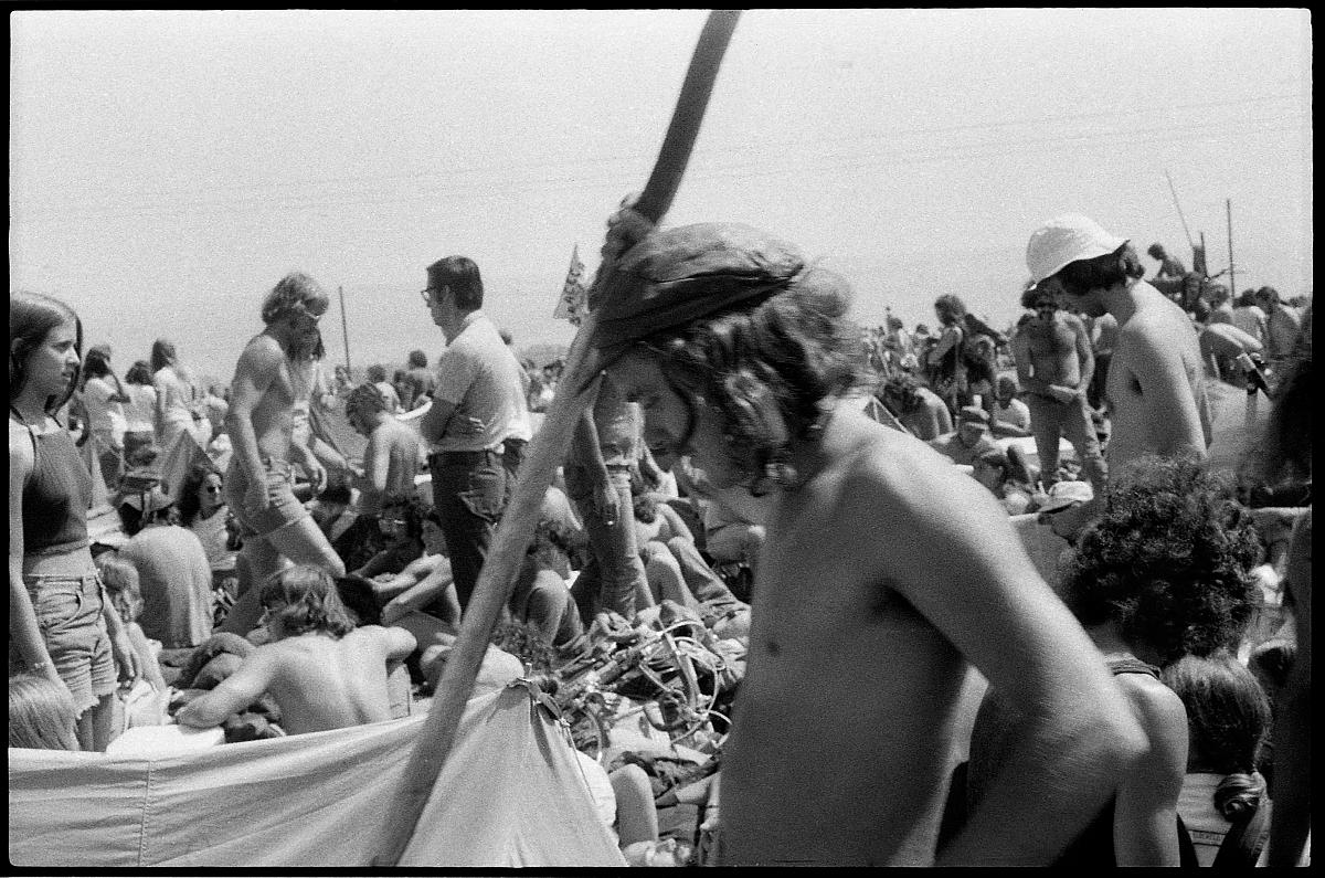 A03_049a.jpg -  People were constantly moving around, trying to get closer to the stage, to find lost friends, food, drink, or a Port-O-San. But there were no real paths or walkways... you just had to pick your way between (and often over) people.