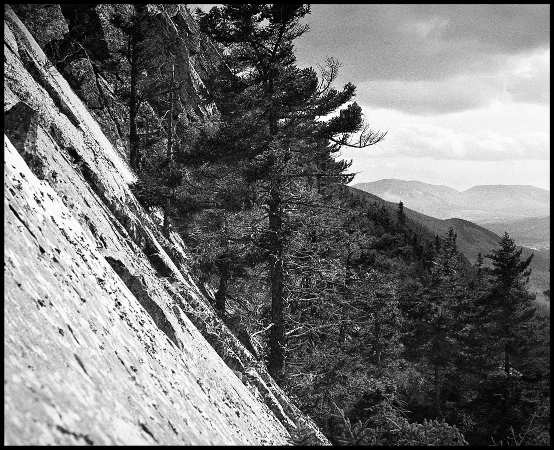 26a.jpg - Looking sideways was almost as bad as looking down.  A fifty degree slope doesn't sound all that steep, but when all you have to grab on to are small cracks in the rocks, it can get a little scary... especially if you've never climbed before.  Plus it was starting to get a little cold.
