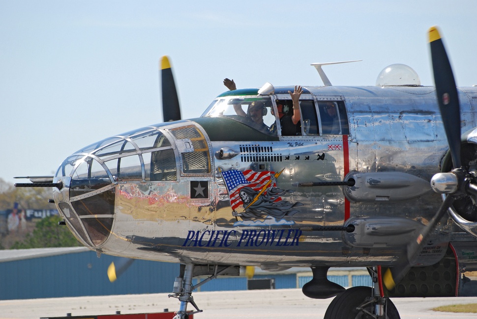 DSC_6644a.jpg - "Pacific Prowler" pilots wave to the crowd.  Notice the navigator's observation bubble on top instead of the gun turret on "Panchito."