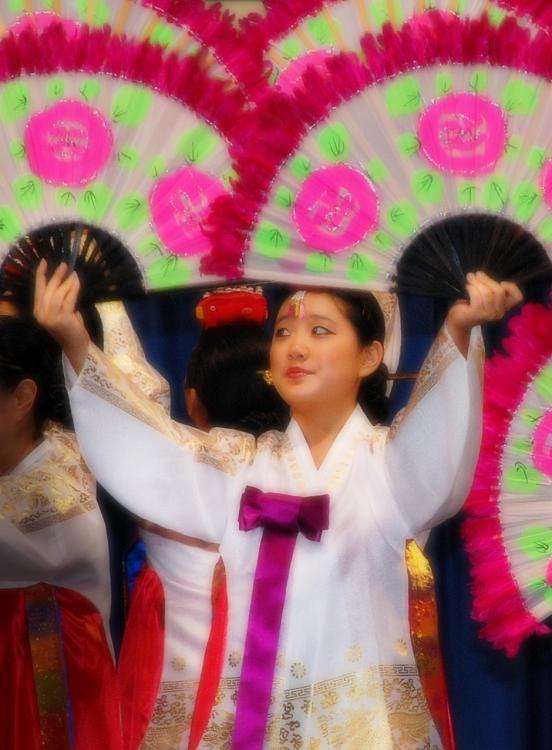 DSC_9173b.jpg - A dancer at the International Festival in Columbus, GA.  This image was shot from pretty far away, out of the range of my flash.   A bit of post-processing was done in Photoshop to intensify the colors and to add a soft glow.