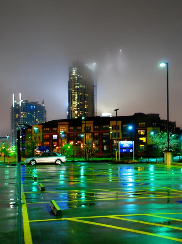 BH09_03_0916a.jpg - Parking lot, downtown Atlanta, GA.  Low cloud cover obscured the top of the building and the large crane behind it.  I had to use a really slow shutter speed but didn't have my tripod so I ended up bracing the camera on a light pole.