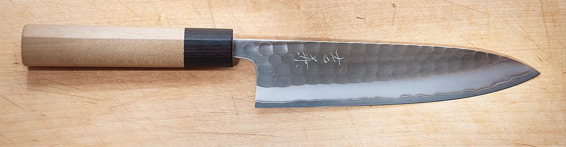 BH09_12_1962a.jpg - Yoshikane chef's knife.  This was part of an experiment to figure out how to produce even illumination with a single light source.  An SB800 electronic flash was used with an umberella and two white reflectors.