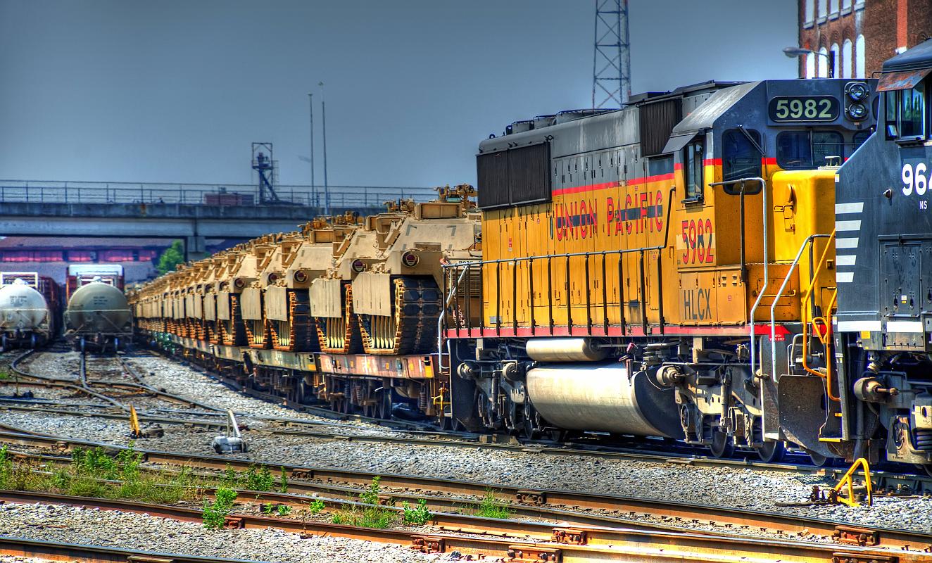 H11_6318b.jpg - Tonemapped image of M1 Abrams tanks moving through the railroad yard in Columbus, GA.