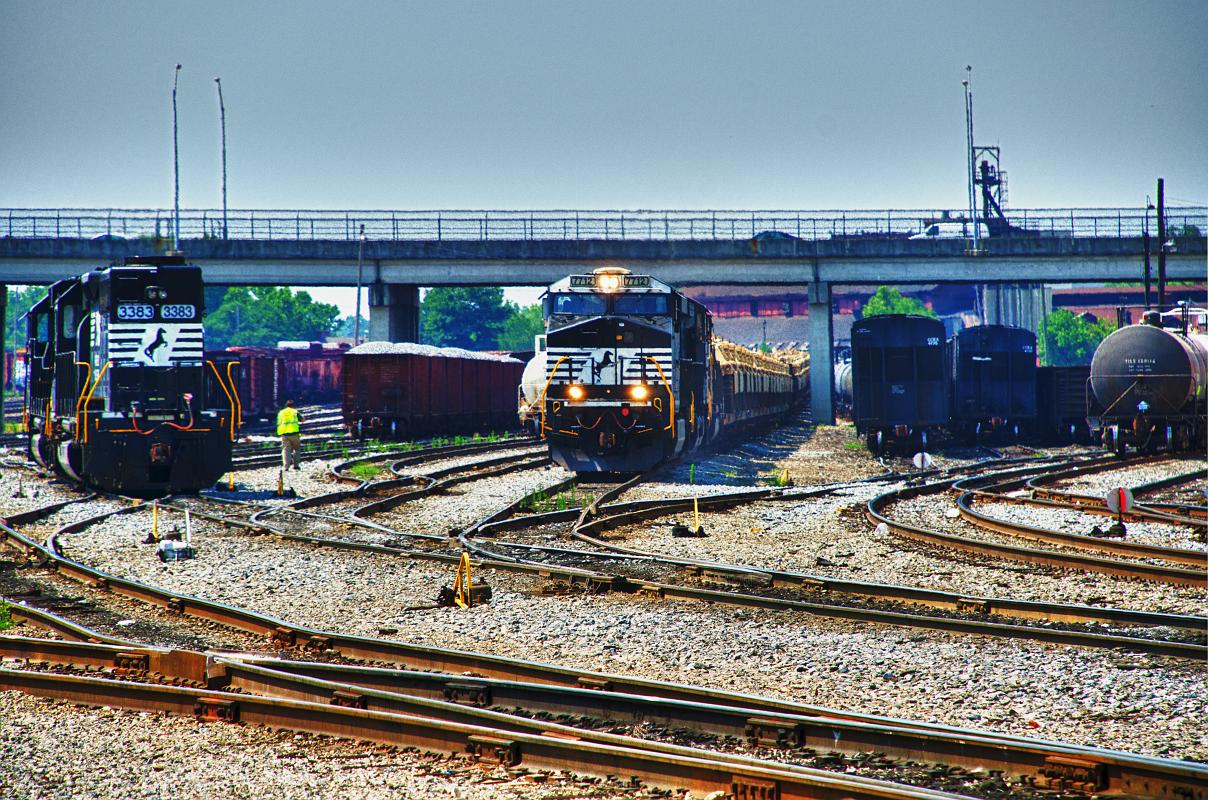 H11_6323a.jpg - Tonemapped image of M1 Abrams tanks moving through the railroad yard in Columbus, GA.